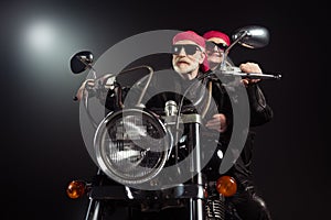 Photo of two cool old bikers white hair man lady couple drive vintage chopper traveling together feel young wear rocker