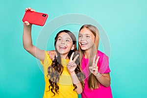 Photo of two excited cute good trendy beautiful blonde brunette girls people wearing t-shirts yellow pink spending free