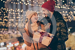 Photo of two people amazed girl get from loving husband dream gift box under evening x-mas outside illumination