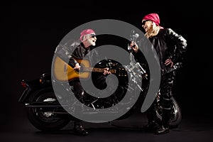Photo of two people old bikers man lady duet chopper moto rock festival meeting play guitar sing songs youth years