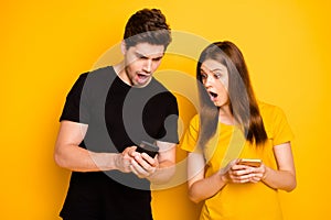 Photo of two people outraged angry seeing fake news spreading browsing through social media watching information being