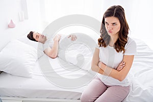 Photo of two people sad upset angry girl cross arms have evening problem argument scandal with husband he sleep nap she