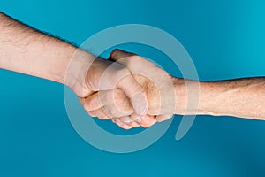 Photo of two senior female young male arms shacking hands signing care contract isolated blue color background