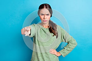 Photo of unsatisfied furious girl pointing finger camera you blame accuse isolated on blue color background