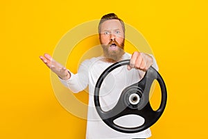 Photo unsatisfied furious person guy hand arm hold wheel yell scream whf negative reaction isolated on yellow color