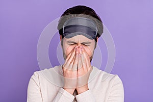 Photo of unsatisfied young person arms cover nose closed eyes bad mood isolated on purple color background