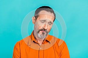 Photo of upset unhappy depressed man with white gray beard wear stylish shirt look down empty space isolated on teal