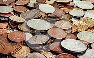 Photo of various european coins pile, side view