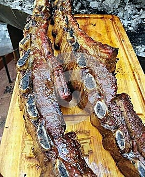 photo of veal cutlets done on the grill whole and then divided with a knife
