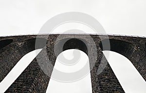 Photo of viaduct - wide angle shot. Architecture photography - arch of railways from the ground