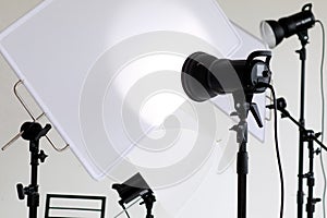 Photo or video studio with white soft screen and light equipments for shooting