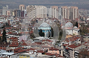Photo with the view of the city of Bursa (Turkiye) with many mosques and a Green Tomb in the center of the photo