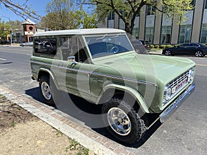 Vintage Green Ford Bronco Parked on a Street