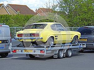 Vintage classic ford capri car on transporter vehicle lorry towed tow