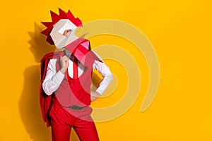 Photo of wacky surreal guy hold jacket prepare carnival outfit wear rooster mask red suit isolated yellow color