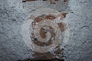 Photo of a wall covered with cement plaster on the side