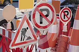 The photo was taken in front of the store selling warning signs used in traffic. Signs in red and white color.