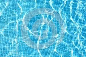Photo of water in swimming pool, surface of blue pool, ripple vacuity in pool, sun reflection in basin, clear light blue pool