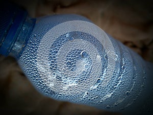 Photo of water vapor condensing in a plastic bottle used for mineral water found in a trash can