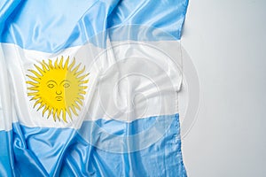 Photo of waving flag of Argentina lying on surface