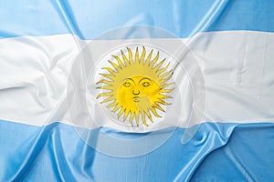 Photo of waving flag of Argentina lying on surface