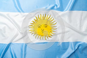 Photo of waving flag of Argentina lying on surface