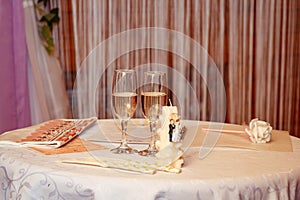 photo wedding decor, filled glasses, cushion for rings, indoors