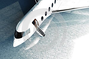 Photo of White Glossy Luxury Generic Design Private Jet parking in hangar airport. Concrete floor. Business Travel