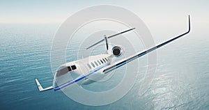 Photo of white luxury generic design private airplane flying over the sea. Empty blue sky at background. Luxury travel