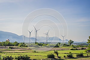 Photo of Wind power installation in sunny day