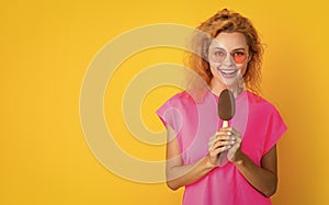 photo of woman with icelolly ice cream at summer, copy space. woman with icelolly ice cream