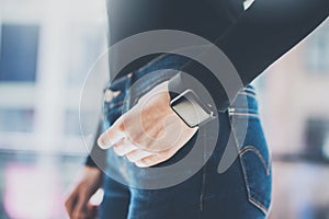 Photo Woman in Modern Loft Office,Wearing Generic Design Smart Watch.Soft Reflections on the Black Empty Screen