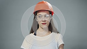 Photo of woman with orange helmet and glasses