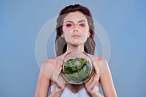 Photo of woman with shiny make up hold glass sphere green plant extract isolated grey color background