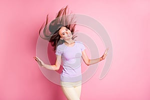 Photo of wonderful dreamy girl closed eyes raised hands flowing hair wear casual cloth solated on pink color background