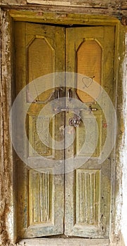 Photo of wooden door of old Indian house in hilly area of Himachal Pradesh, India