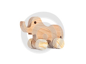 Photo of a wooden elephant on wheels of beech.