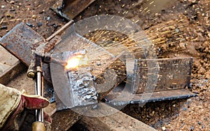 Photo of worker doing gas cutting on steel