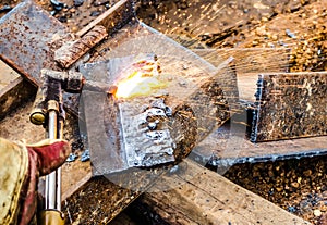 Photo of worker doing gas cutting on steel