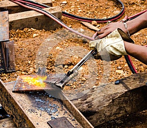 Photo of worker doing gas cutting on steel