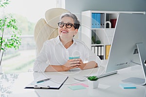 Photo of workstation expert team leader it company pensioner age woman gray hair waiting her coffee break isolated on