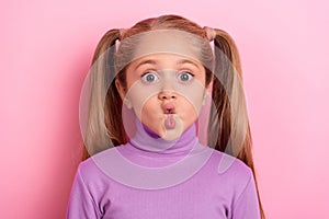 Photo of young adorable cute little girl make hilarious silly faces pout lips isolated on pink color background