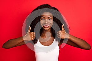 Photo of young african girl happy positive smile show thumb-up like cool fine isolated over red color background