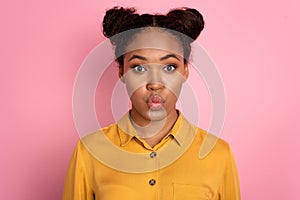 Photo of young african lady pouted lips send air kiss romantic valentine day isolated over pink color background