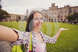 Photo of young attractive girl happy positive smile make selfie smartphone show demonstrate hand university travel