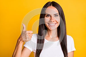 Photo of young attractive woman happy positive smile show thumb-up like cool perfect advert isolated over yellow color