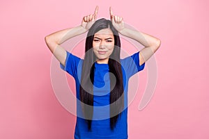 Photo of young attractive woman hold fingers head horns evil frightening isolated on pink color background