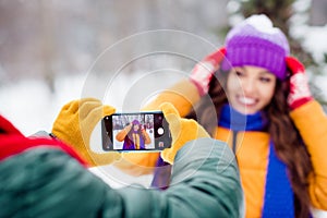 Photo of young attractive woman man make picture photographing smartphone snowy weather happy positive smile walk