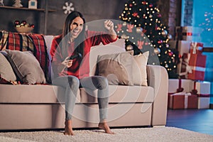 Photo of young beautiful attractive crazy excited smiling positive woman sit sofa play win videogame shout yeah at home