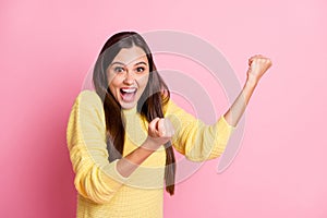 Photo of young beautiful excited crazy amazed ecstatic woman hold fists up scream isolated on pink color background